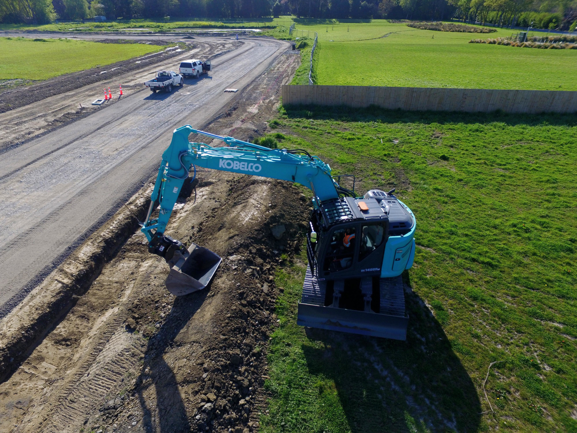 Excavator performing site preparation and earthworks for a construction project in Canterbury