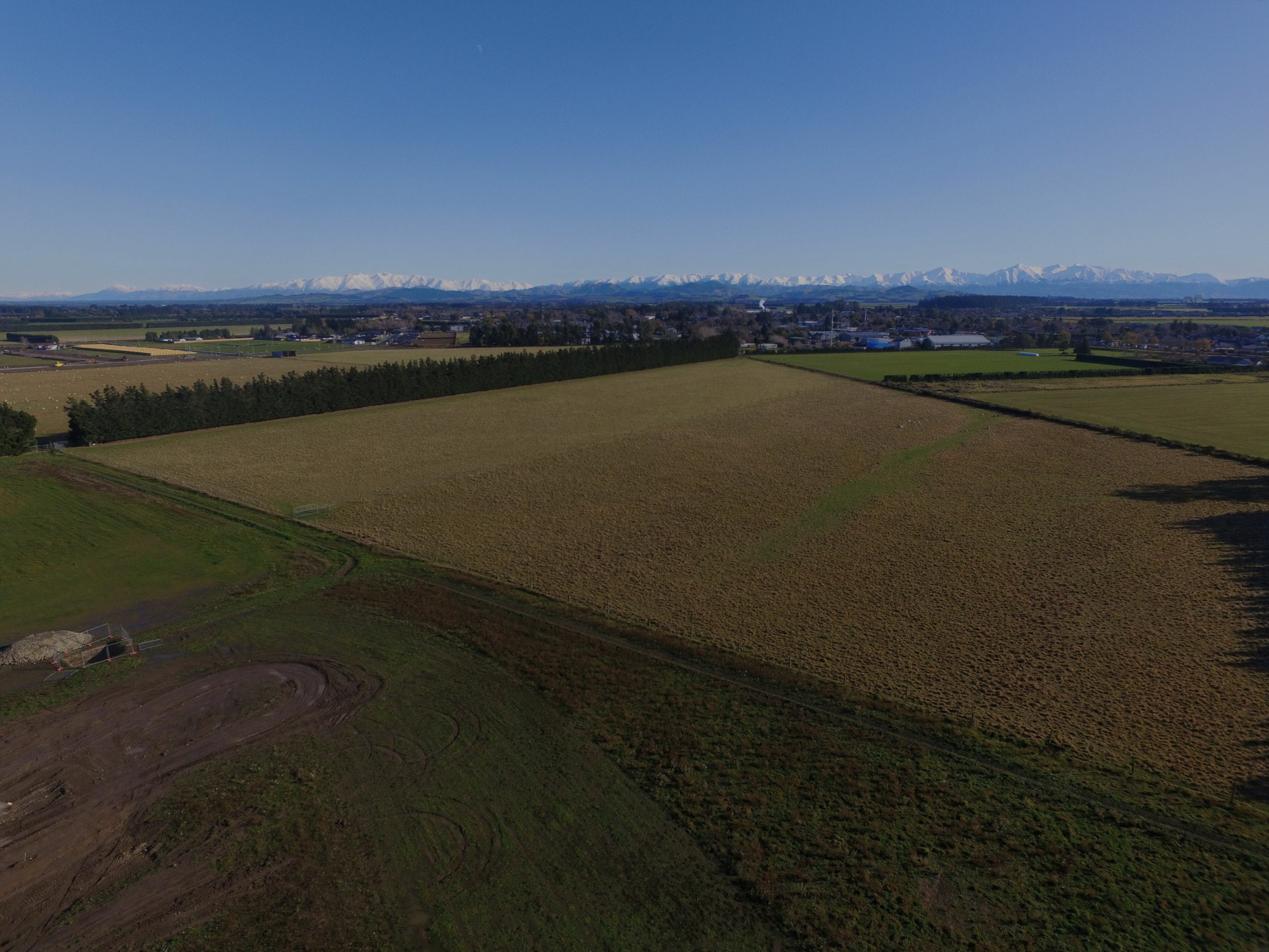 Darfield subdivision site preparation by EDR Contracting — Canterbury civil contractors starting first-stage earthworks and soil stripping with the Southern Alps in the background.